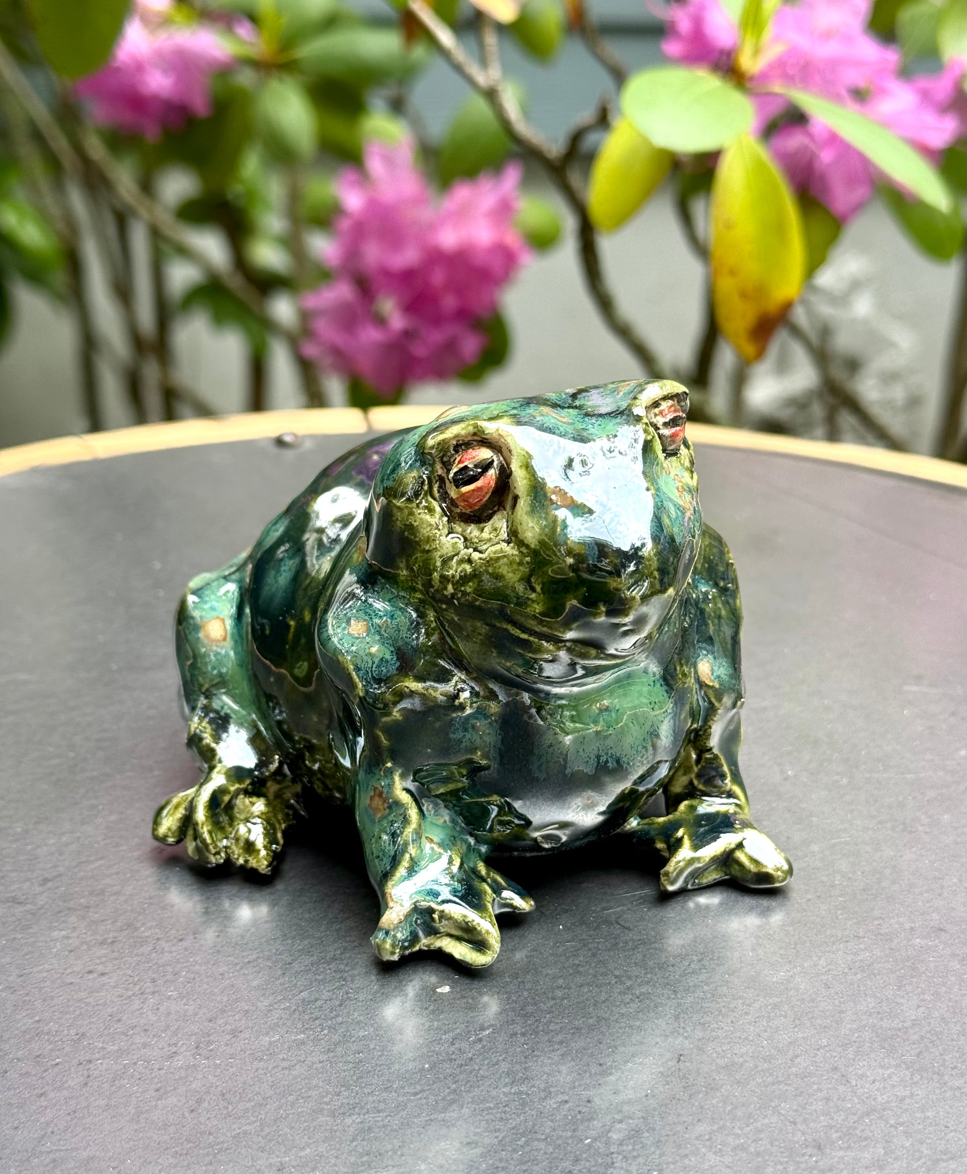 Handmade ceramic Mr. Frog sculpture in sitting position with green glaze