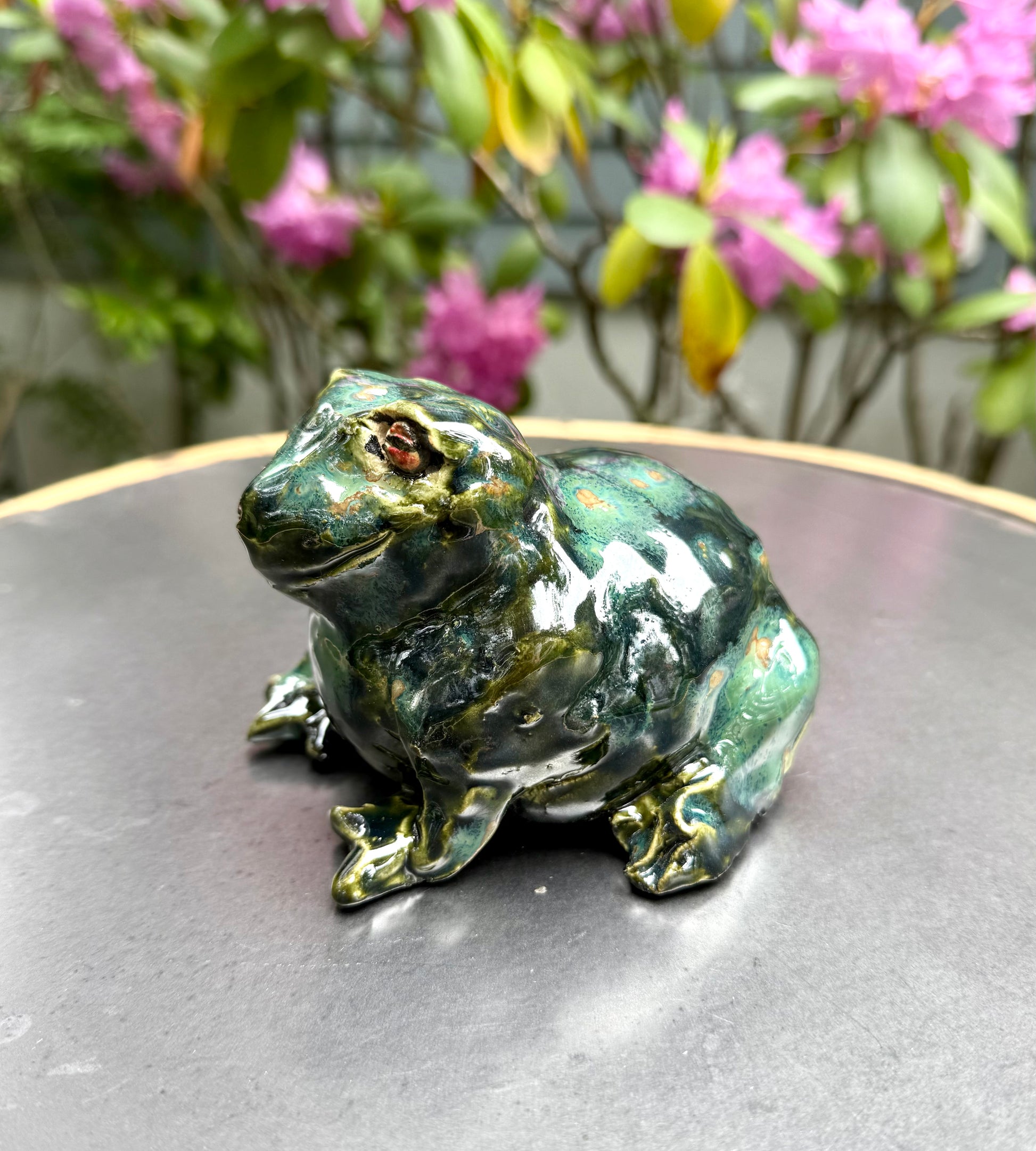 Close-up of Mr. Frog’s face showing hand-sculpted features