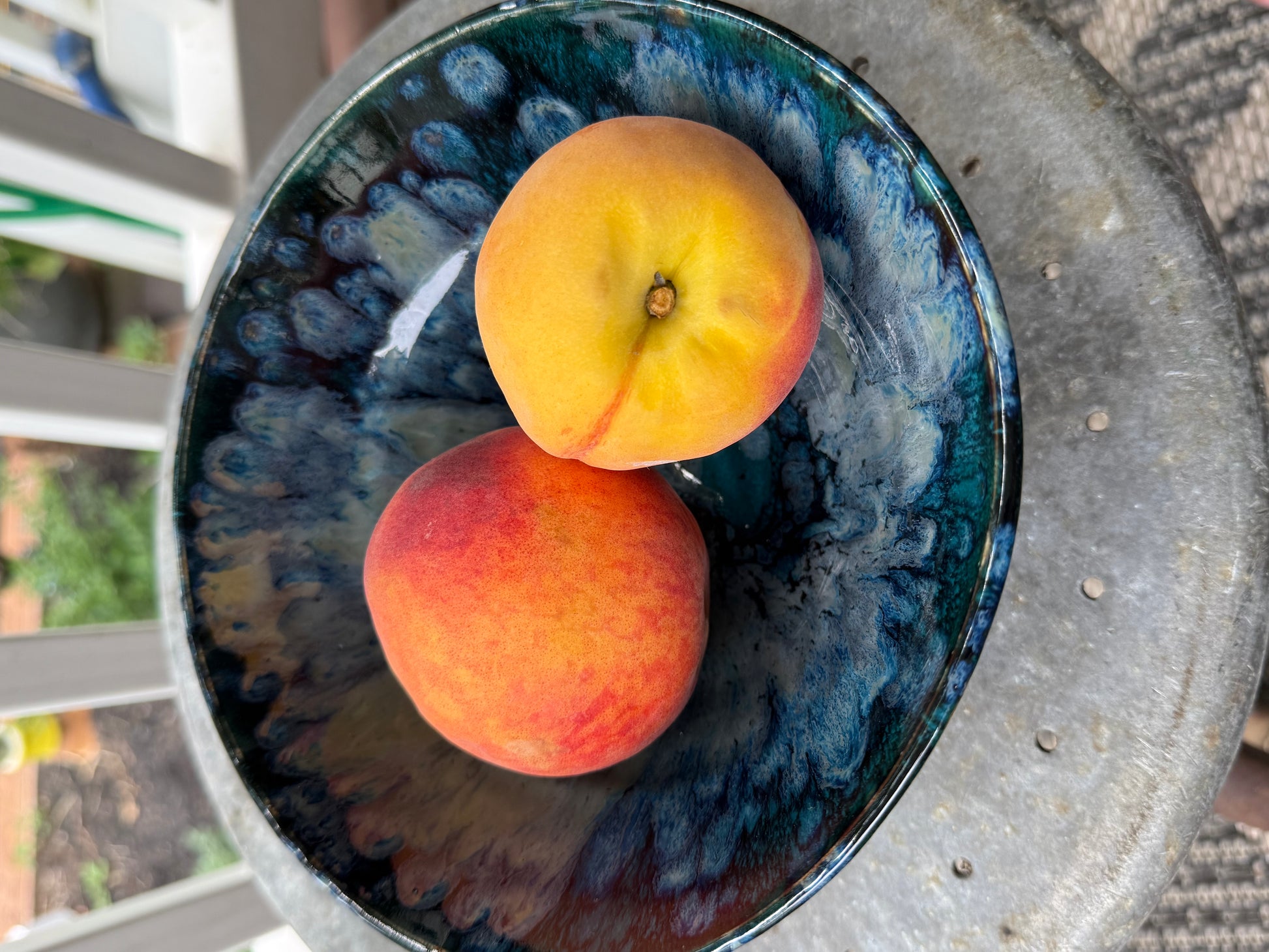 Close-up detail of handmade ceramic bowl showing textured glaze movement