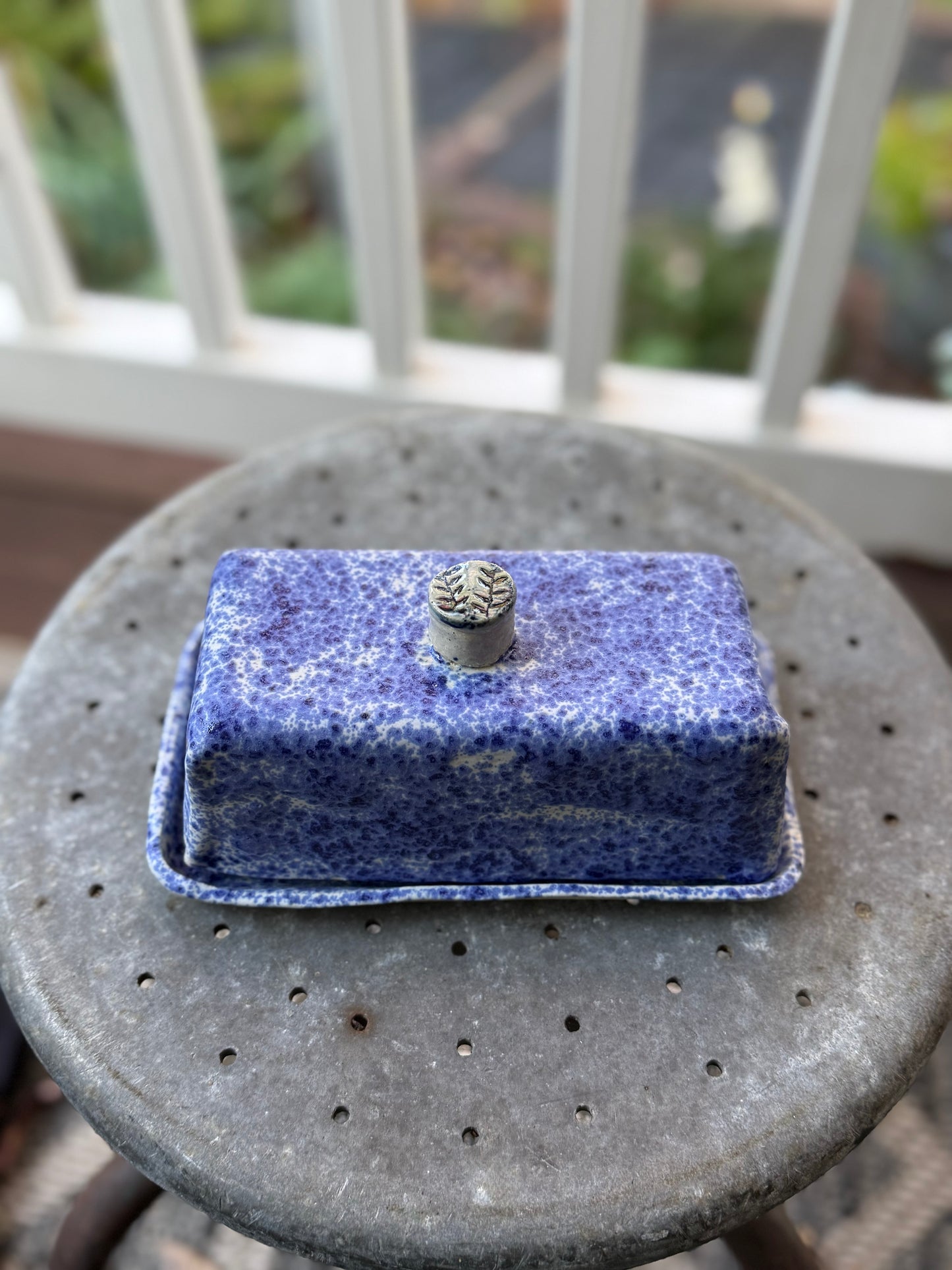 Handmade ceramic butter dish with blue freckles