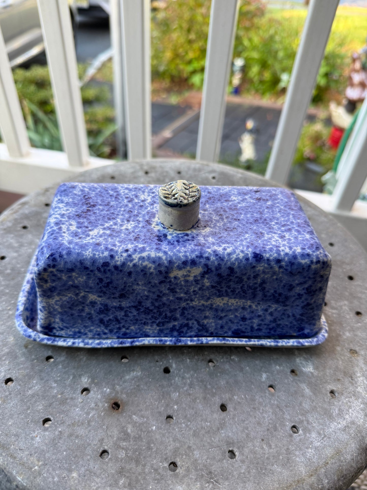 Handmade ceramic butter dish with blue freckles
